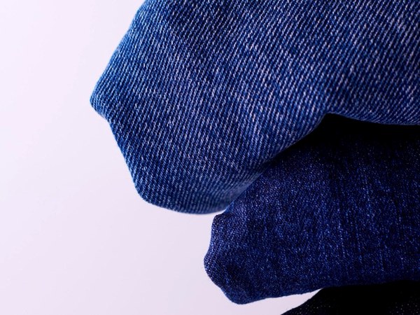 Close-up of denim stitching and hardware after washing