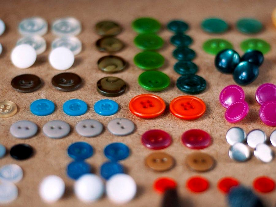 Buttons and garment trims laid out for approval